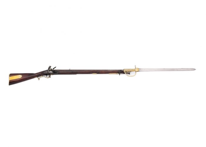 a photo of a rilfe with an attached bayonet