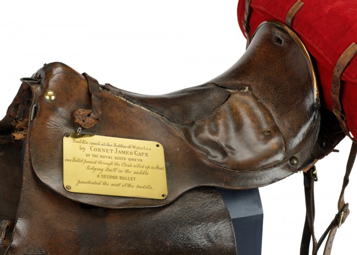 Saddle holed by bullets at Waterloo. Copyright Royal Scots Dragoon Guards Museum.