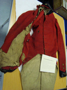 Captain Noel Harris' coat, showing ball entry damage in right sleeve (cut open for surgery) and right side. (Courtesy of Mr Alan Harrison)
