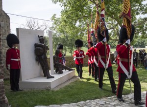 Colour Sergeants march past the magnificent new bronze sculpture featuring two British soldiers, by Vivienne Mallock, which was unveiled as a new memorial to all the British dead. Photographer: Sergeant Rupert Frere RLC