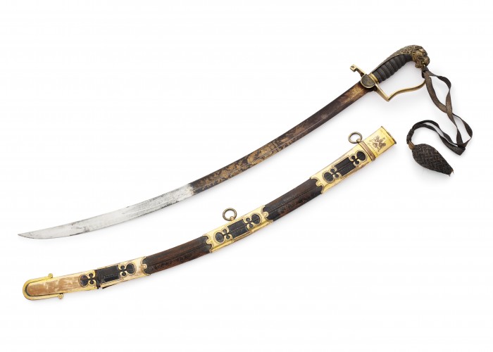a photograph of a sword and scabbard with gilt detailing