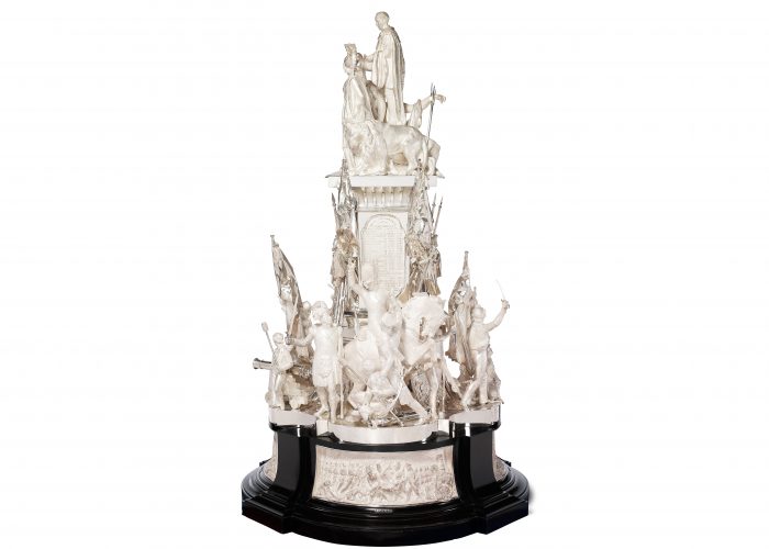 A photo of a large silver trophy with a prolific decoration of Napoleonic soldier figures