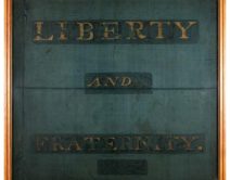 a photo of an old banner with the words Liberty and Fraternity across it