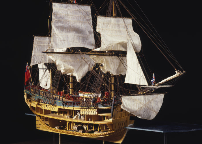 A model of a tall-ship with the side pannels removed so you can see the inner workings of the ship and the different levels.