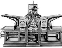 A black and white image of an early printing machine.