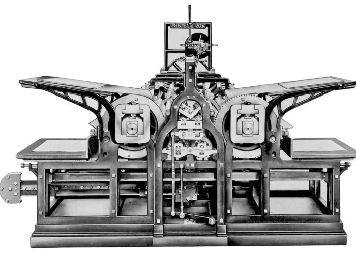 A black and white image of an early printing machine.