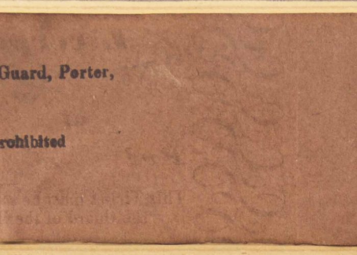 A high resolution image of the back of an old train ticket from Liverpool to Warrington. The ticket is a faded brown colour with black ink