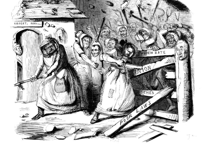 A black and white scan of a political cartoon sketch. The sketch shows an angry mob hacking down a gate. The gate posts are enshrined with the words ‘church rate’, ‘union’, ‘tithes’, and ‘poor laws’. On the left hand side a scared looking man peeks at the mob from behind a door above which a plaque reads ‘Robert. Peel’. The title below the image reads ‘Rebecca and her Daughters’.