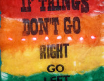 a homemade felt protest banner reading 'if things don't go right go left'