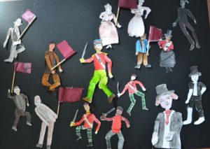 a group of paper puppets