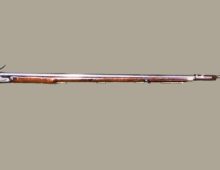 a wooden gun with long barrel