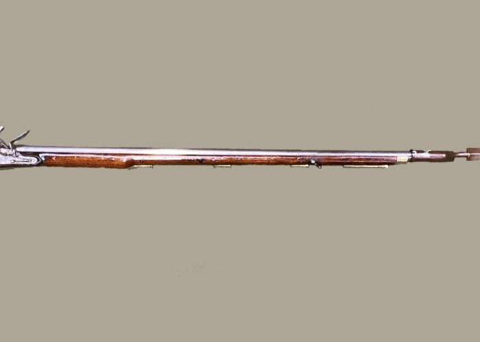a wooden gun with long barrel