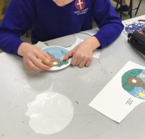 student making plate designs